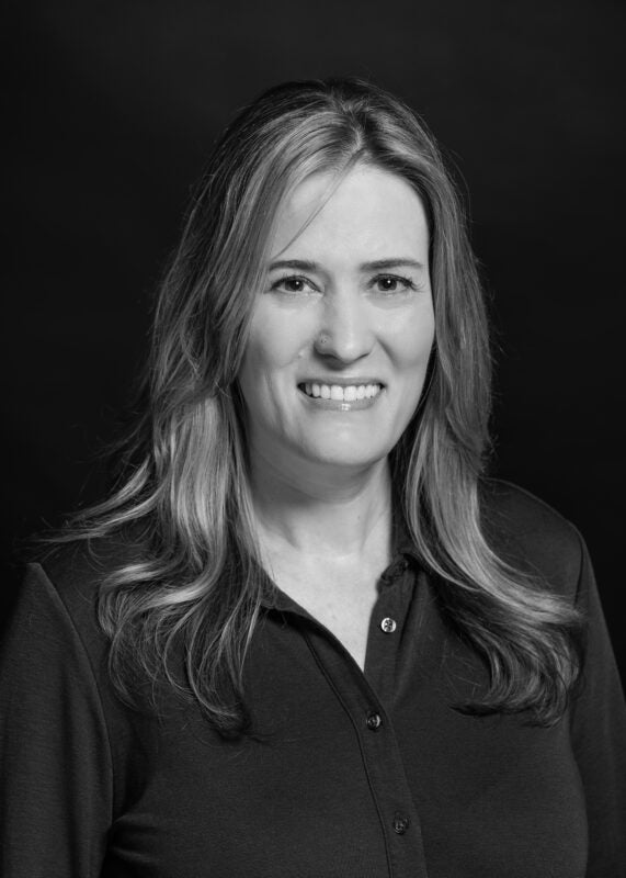 Black and white photo of Angela Crossman. Angela Crossman is Dragos’s Chief People Officer (CPO).